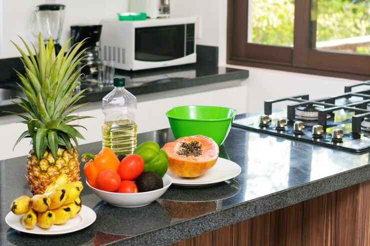 A kitchen in a serviced apartment highlighting eco-friendly appliances