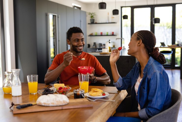 Travelers enjoying a home-cooked meal in a serviced apartment